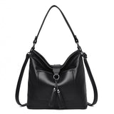 Large women hobo bag with tassel decoration and detachable long strap in pu leather