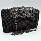 Studded Evening Clutch with Ornate Leaf Clasp Detail