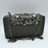 Studded Evening Clutch with Ornate Leaf Clasp Detail