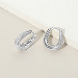 White Gold Dipped CZ Stone Paved Oval Huggie Hoop Earrings