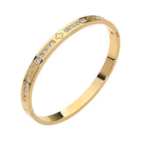 Stainless Steel CZ Accent Quatrefoil Engraved Hinged Bangle Bracelet