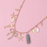 Stone Paved Bow Metal Starfish Fish Shell Pearl Tropical Leaf Charm Station Necklace