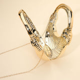 Hard Shell Metallic Sculpted Loop Top Handle Handbag