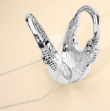 Hard Shell Metallic Sculpted Loop Top Handle Handbag