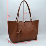 Minimalist Structured Tote Bag with Geometric Cutout and Tassel Accent