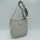 Minimalist Curved Crossbody Bag with Patterned Guitar Strap