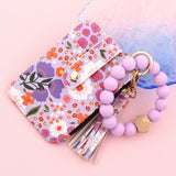 ID bag, silicone bracelet, floral folded edge card bag, TK printed leather wallet, keychain.