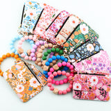 ID bag, silicone bracelet, floral folded edge card bag, TK printed leather wallet, keychain.