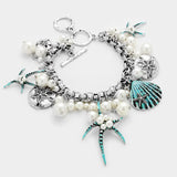 Pearl Embellished Starfish Shell Multi Charm Toggle Bracelet